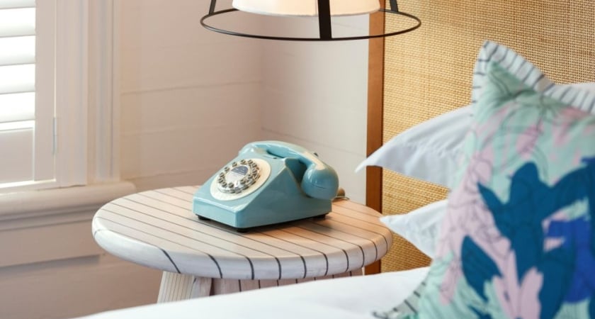 side table with blue phone
